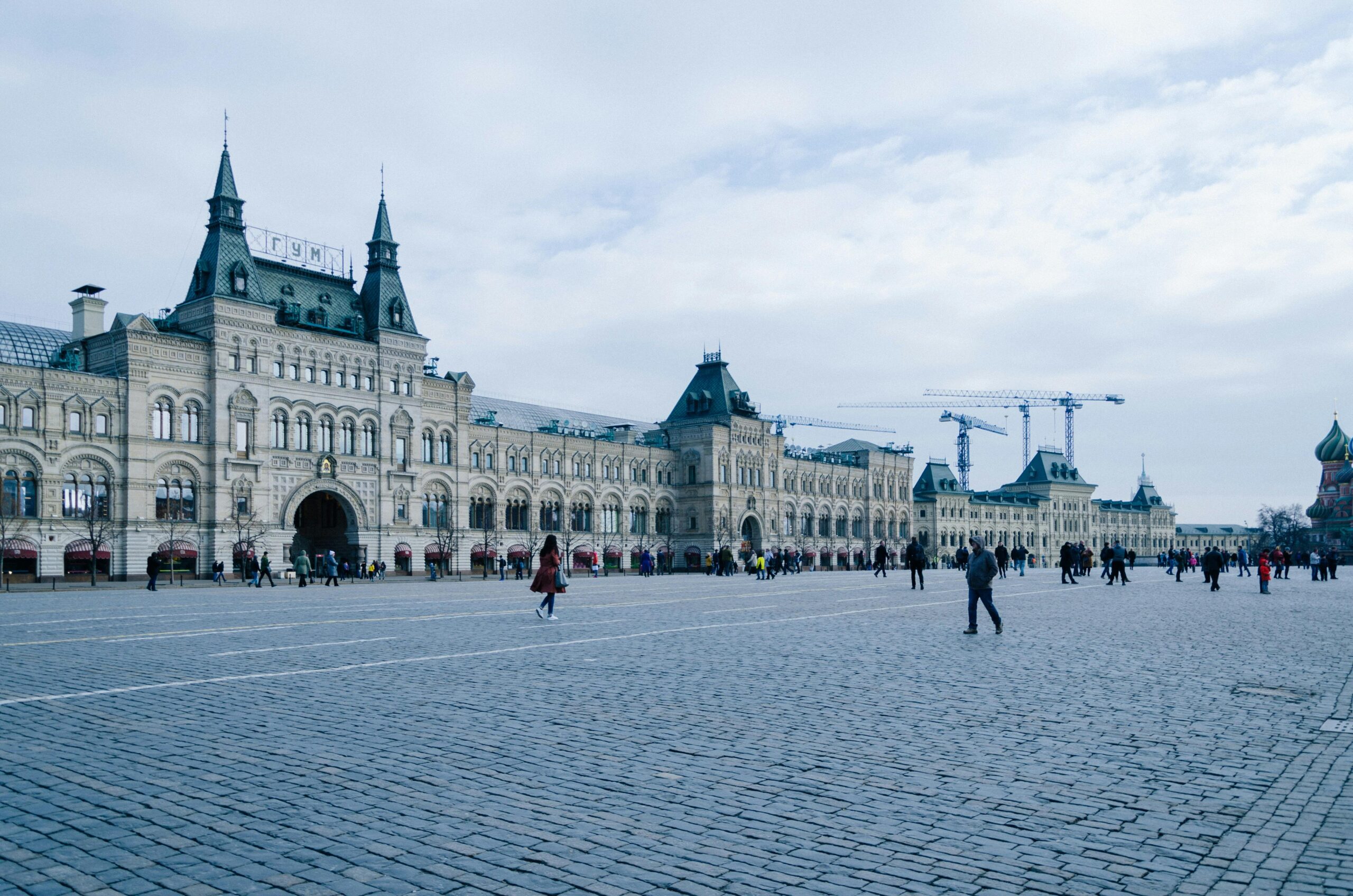 Historic GUM department store facade at Red Square under a cloudy sky, Moscow, Russia.