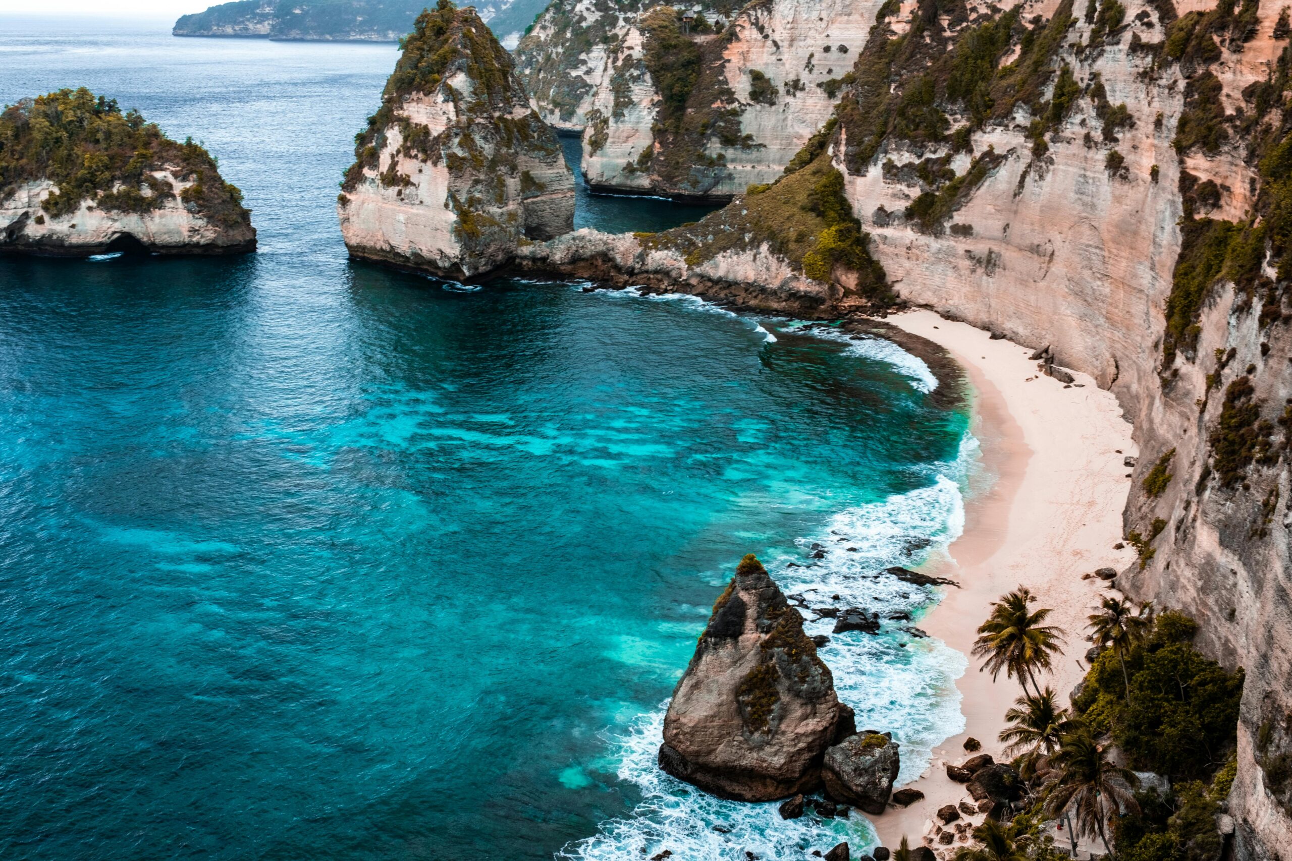 A breathtaking view of Nusa Penida's turquoise waters and rocky cliffs in Bali, Indonesia.