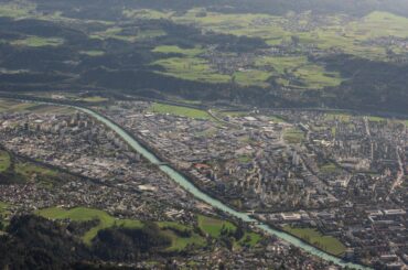 Scenic aerial of Innsbruck, Austria with stunning cityscape and lush green landscape.