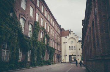 Tampere – A cozy street with brick buildings, ODIT Travels for your Finland Visa from Dubai.
