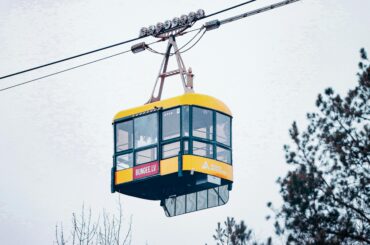 A vibrant cable car in Sigulda, Latvia, perfect for adventure sports enthusiasts.