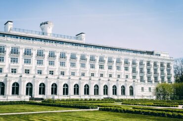 Elegant neoclassical facade of the historic Kemeri Hotel in Jūrmala, Latvia on a sunny day.