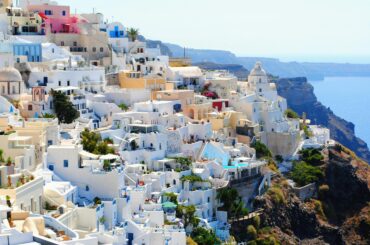 Breathtaking view of Santorini's iconic white and blue architecture against the Aegean Sea.
