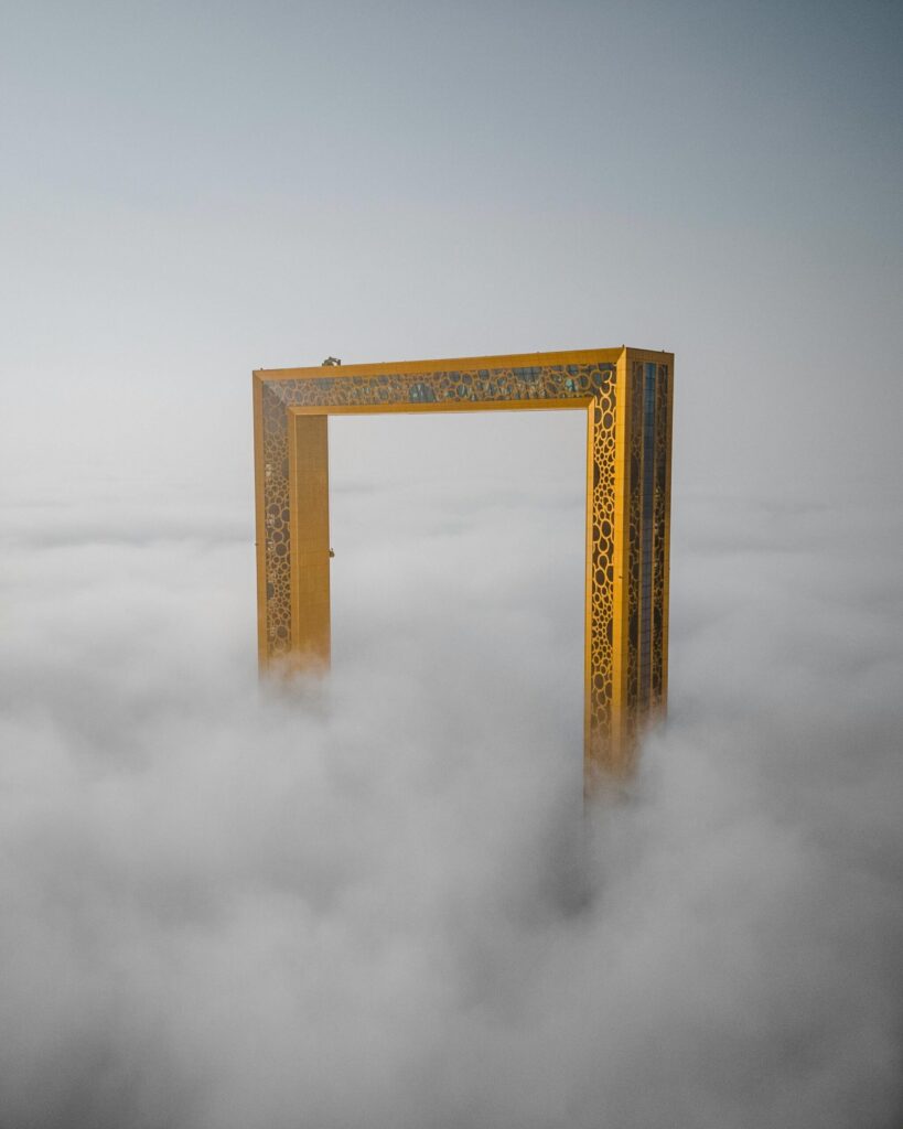 The Dubai Frame, rising above the fog.