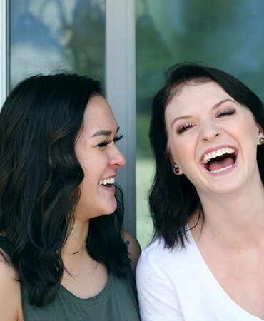 Friendly travel agency team with cheerful expressions welcoming clients.