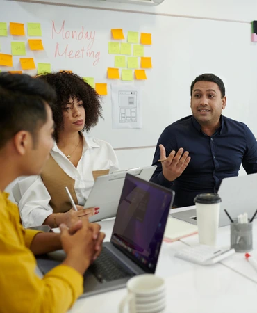 Team meeting focused on training and career development in travel agency