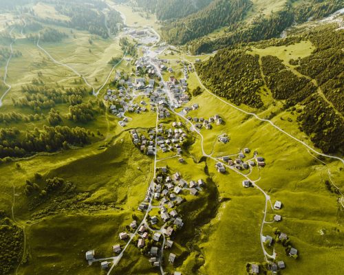 Spectacular aerial view of Malbun village nestled in the lush green mountains of Liechtenstein.