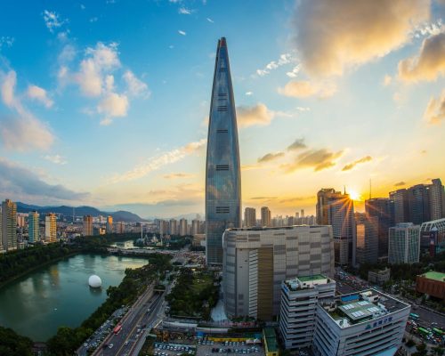 Stunning view of Seoul's skyline featuring Lotte World Tower at sunset.