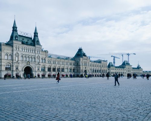 Historic GUM department store facade at Red Square under a cloudy sky, Moscow, Russia.
