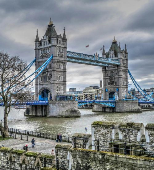 Scenic view of Tower Bridge over the Thames with cloudy sky in London.
